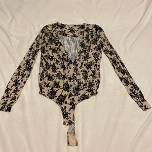Free People nude and black floral print wrap bodysuit